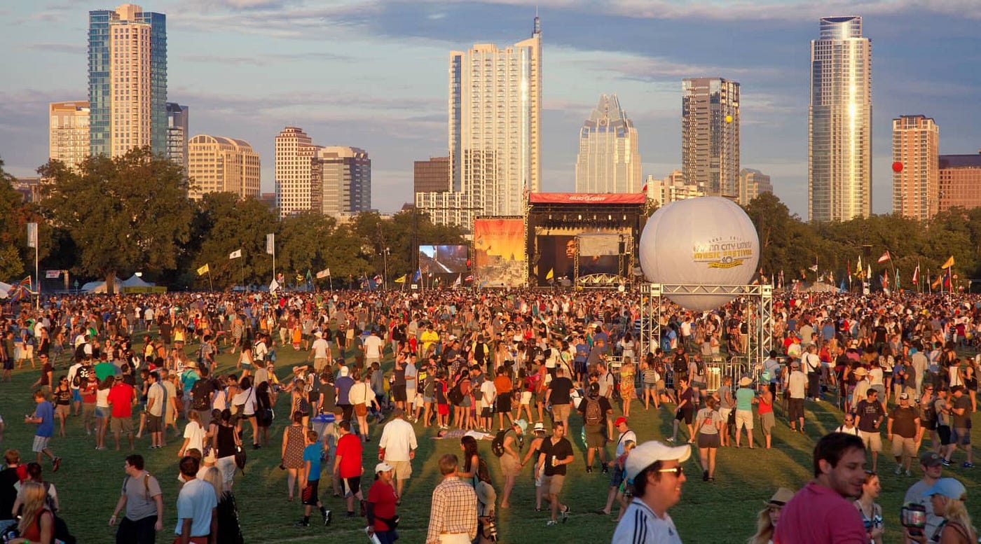 The Austin he loved: downtown skyline at sunset, Austin City Limits crowd in the foreground.